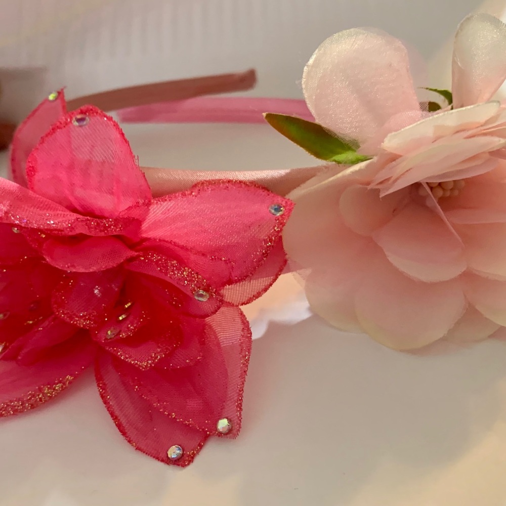 2 inc- Girls pink headbands with flowers attached.